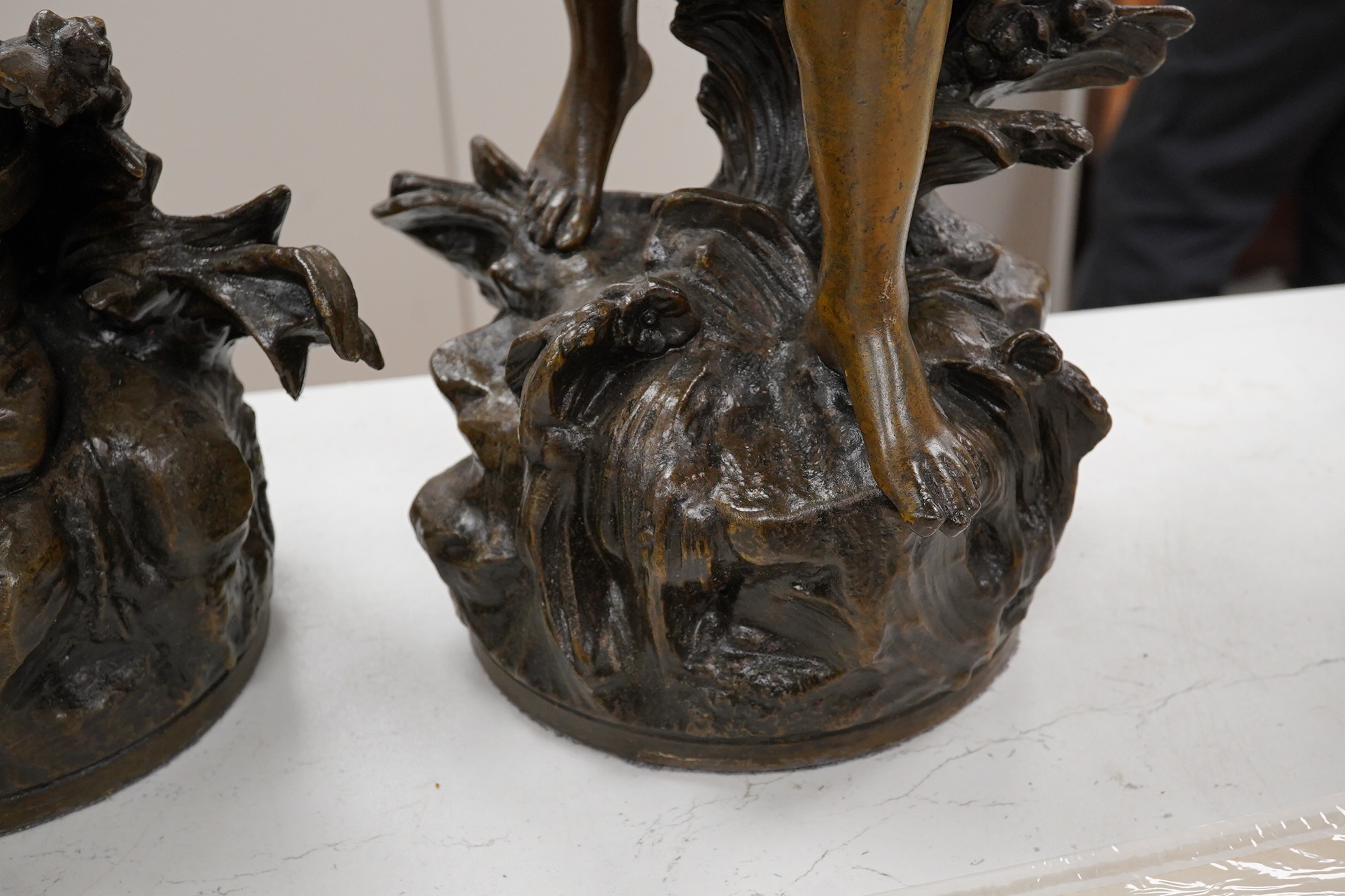 After Auguste Moreau 1861-1906, a pair of spelter figures, 60cm. Condition - fair (pieces missing)